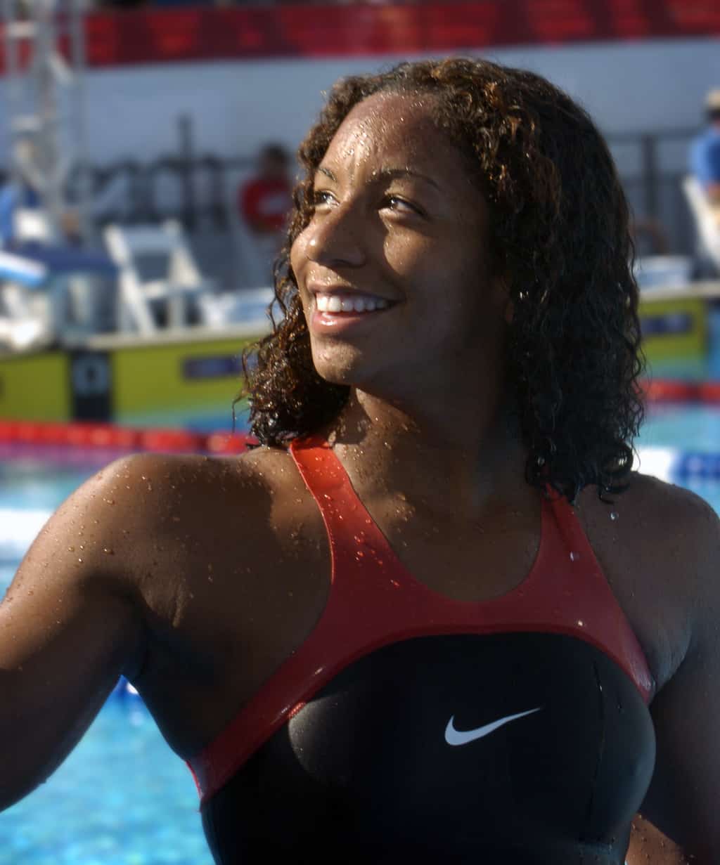 14 Jul 2004, Long Beach, California, United States --- Maritza Correia, the first African American woman to make the U.S. Olympic Women's Swim Team, smiles for the crowd after swimming the Women's 50 meter Freestyle final with a time of 25.15 at the U.S. Olympic Team Trials in Long Beach, California. --- Image by © Steven Georges/Press-Telegram/Corbis